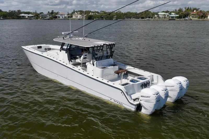 Slide: The Image of 2020 Freeman 42LR boat with Mercury engines on a calm lake. - 9