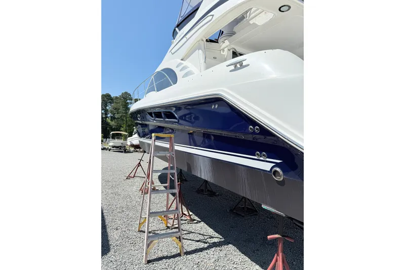Slide: The Image of 2007 Sea Ray 44 Sedan Bridge yacht on stands, side view with ladder. - 13