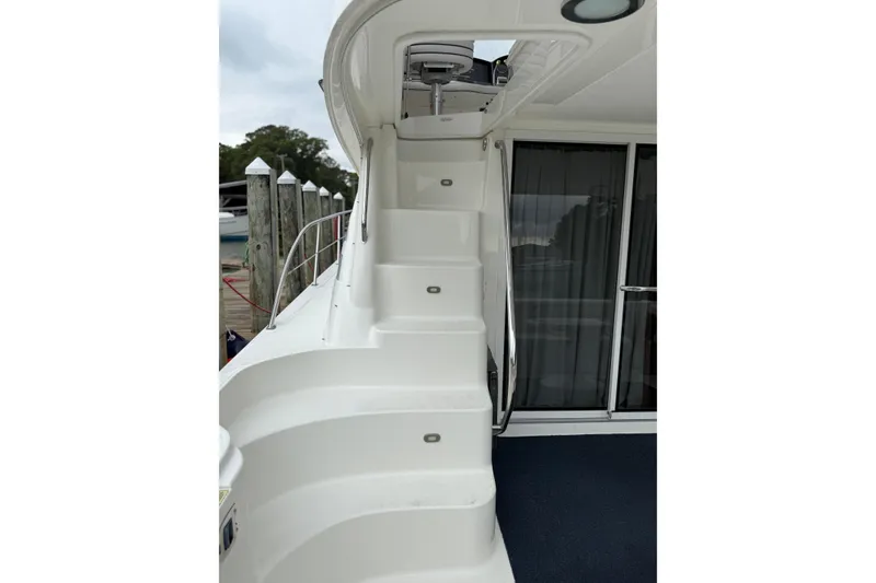 Slide: The Image of Staircase on 2007 Sea Ray 44 Sedan Bridge yacht, leading to upper deck. - 24