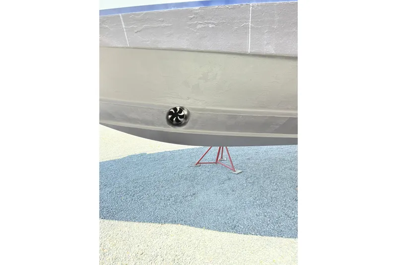 Slide: The Image of 2007 Sea Ray 44 Sedan Bridge hull with visible propeller on dry dock. - 29