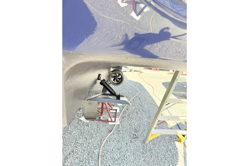 Slide: The Image of 2007 Sea Ray 44 Sedan Bridge hull detail with visible propeller and maintenance equipment. - 32