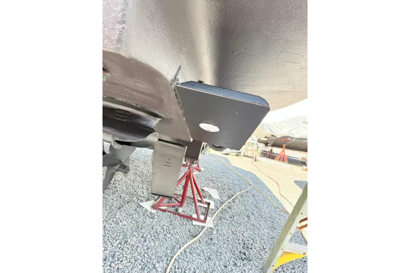 Slide: The Image of Close-up of 2007 Sea Ray 44 Sedan Bridge propeller and hull on gravel. - 33