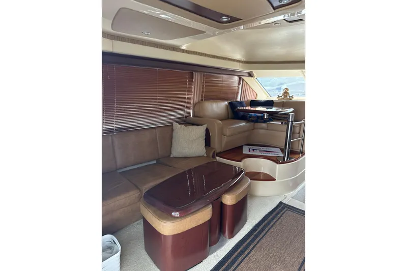Slide: The Image of Luxurious interior of 2007 Sea Ray 44 Sedan Bridge yacht with elegant seating and table. - 34