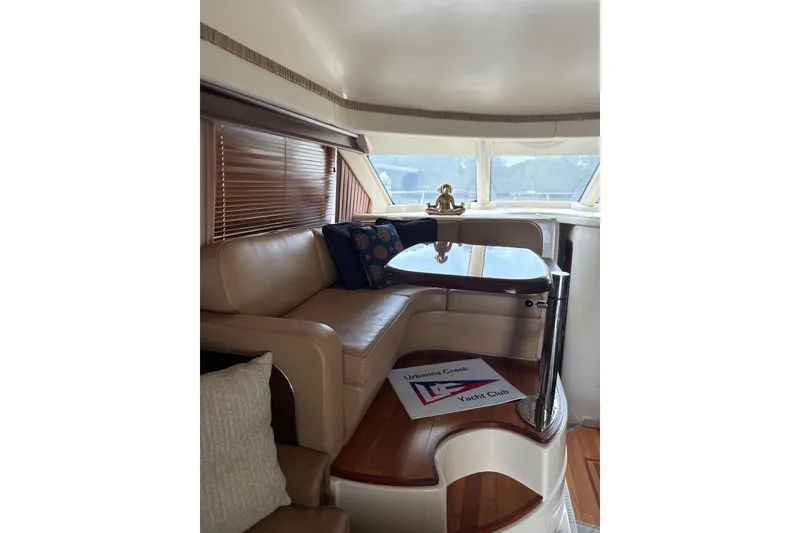 Slide: The Image of Luxurious interior of 2007 Sea Ray 44 Sedan Bridge yacht with elegant seating and table. - 37