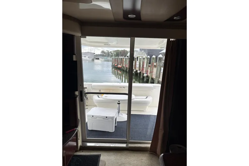 Slide: The Image of Interior view from a 2007 Sea Ray 44 Sedan Bridge yacht, overlooking marina. - 38