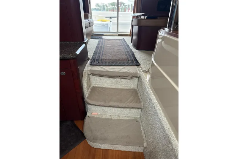 Slide: The Image of Interior stairs of 2007 Sea Ray 44 Sedan Bridge yacht with carpeted steps. - 39
