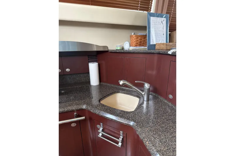 Slide: The Image of Luxurious kitchen area in 2007 Sea Ray 44 Sedan Bridge yacht. - 44