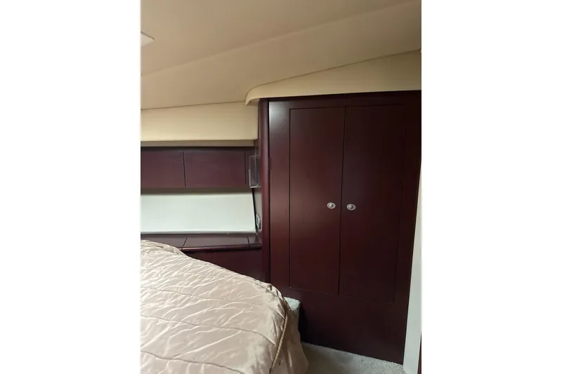Slide: The Image of Interior cabin of 2007 Sea Ray 44 Sedan Bridge with wooden cabinetry. - 51