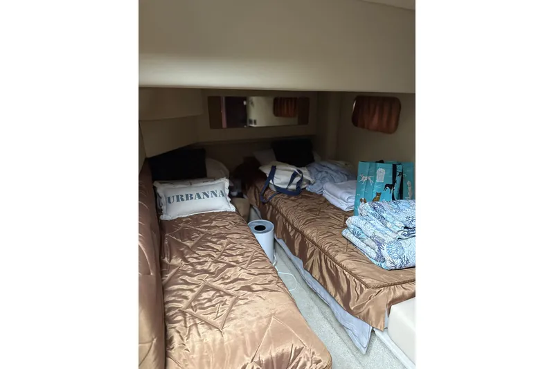 Slide: The Image of Interior cabin of 2007 Sea Ray 44 Sedan Bridge with twin beds and cozy decor. - 54