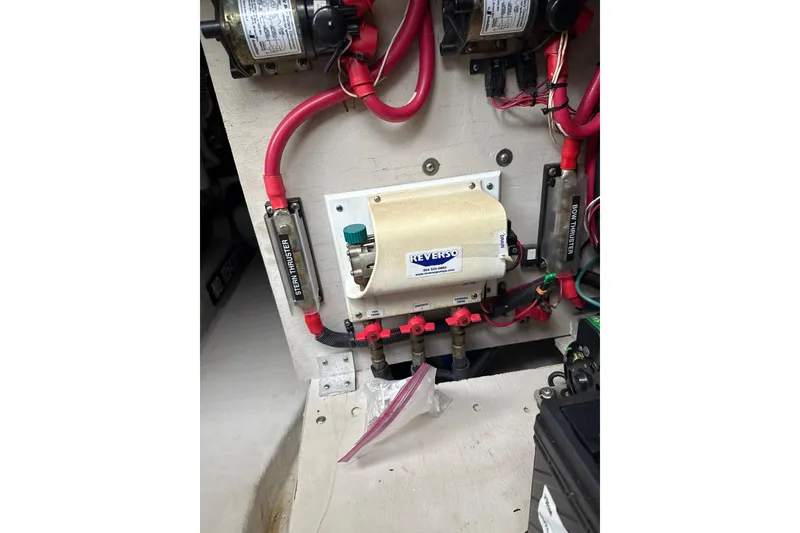 Slide: The Image of Electrical components and wiring inside a 2007 Sea Ray 44 Sedan Bridge boat. - 63