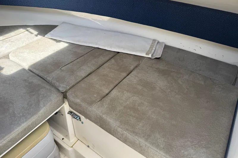 Slide: The Image of Cushioned seating area on a 2000 Boston Whaler 21 Conquest boat. - 14