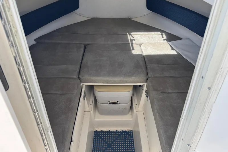 Slide: The Image of Interior cabin of 2000 Boston Whaler 21 Conquest boat with cushioned seating. - 15
