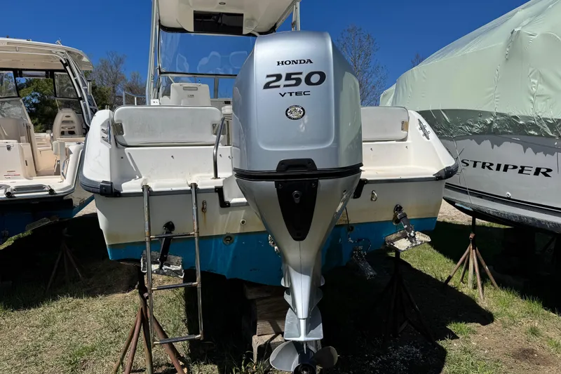 Slide: The Image of Boston Whaler 21 Conquest 2000 with Honda 250 VTEC outboard motor on stands. - 3