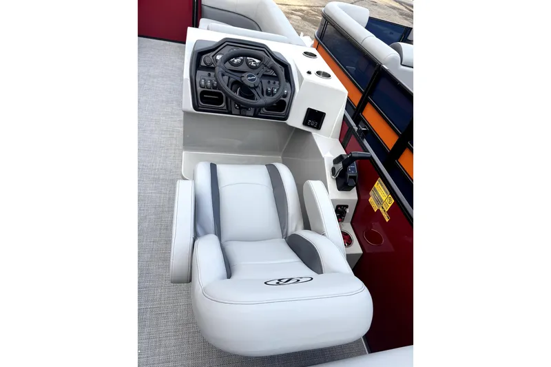 Slide: The Image of 2026 Bentley Pontoons Legacy 220 Navigator helm with modern controls and plush seating. - 10