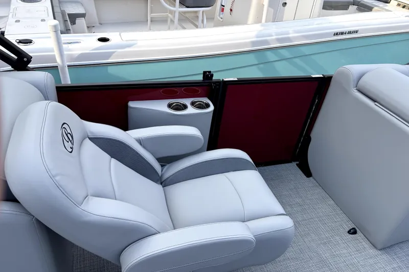 Slide: The Image of Luxurious seating on 2026 Bentley Pontoons Legacy 220 Navigator with cup holders and sleek design. - 11