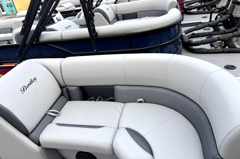 Slide: The Image of 2026 Bentley Pontoons Legacy 220 Navigator with luxurious seating and elegant design. - 13