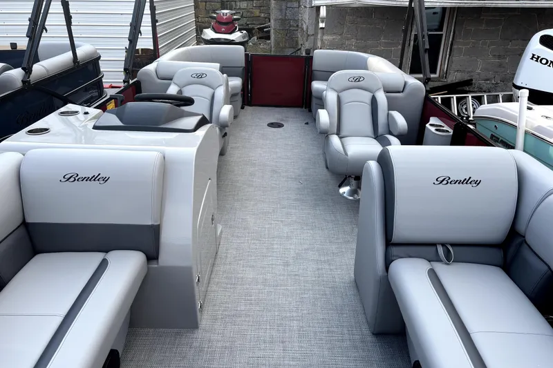 Slide: The Image of 2026 Bentley Pontoons Legacy 220 Navigator interior with luxurious seating and modern design. - 6