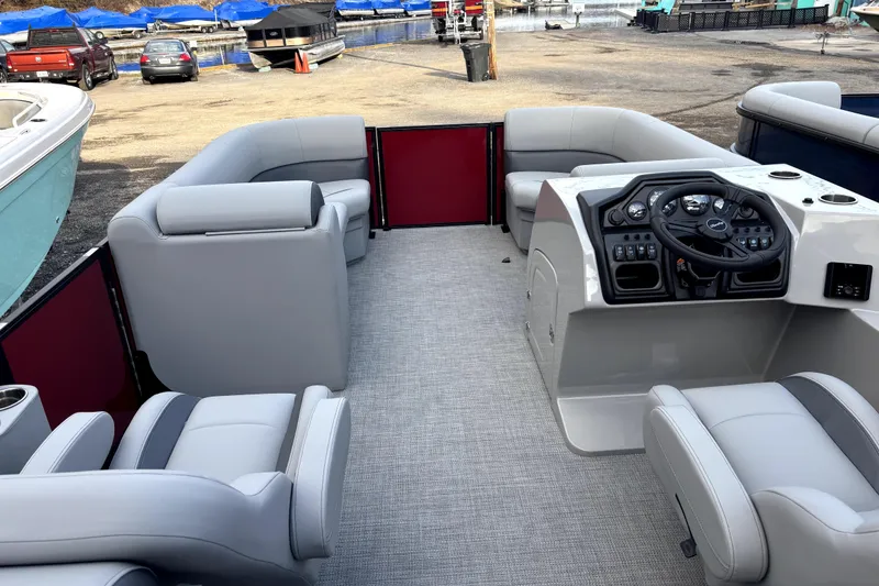 Slide: The Image of 2026 Bentley Pontoons Legacy 220 Navigator interior with plush seating and modern helm. - 7