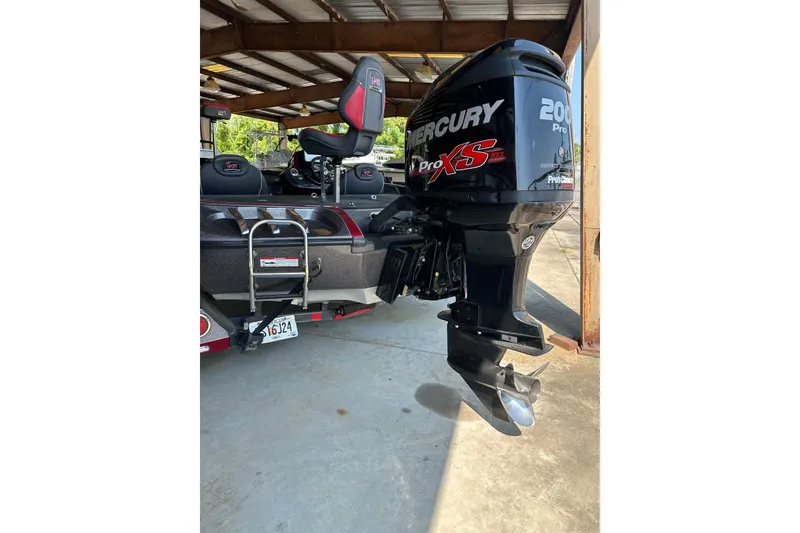 Slide: The Image of 2017 Ranger Z518 Comanche boat with Mercury Pro XS outboard motor in a covered area. - 6