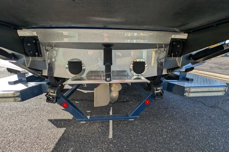 Slide: The Image of Rear view of a 2016 MasterCraft X10 boat on a trailer, showing propeller and hull details. - 14