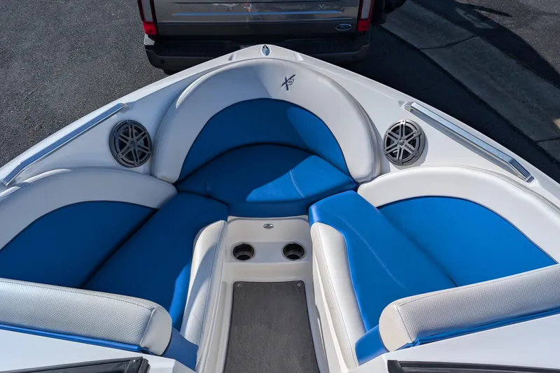 Slide: The Image of 2016 MasterCraft X10 boat interior with blue and white seating and speakers. - 18