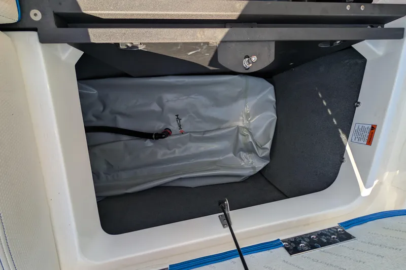 Slide: The Image of 2016 MasterCraft X10 storage compartment with ballast bag and secure latch. - 35