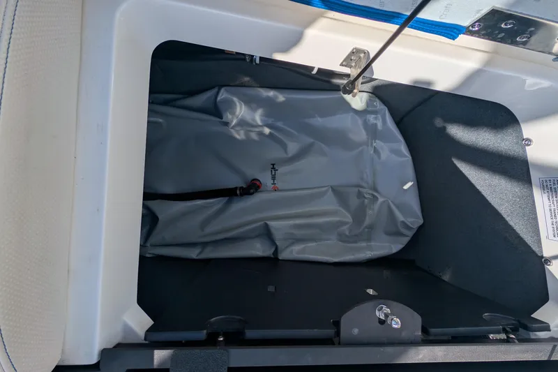 Slide: The Image of 2016 MasterCraft X10 storage compartment with gray bag inside. - 36