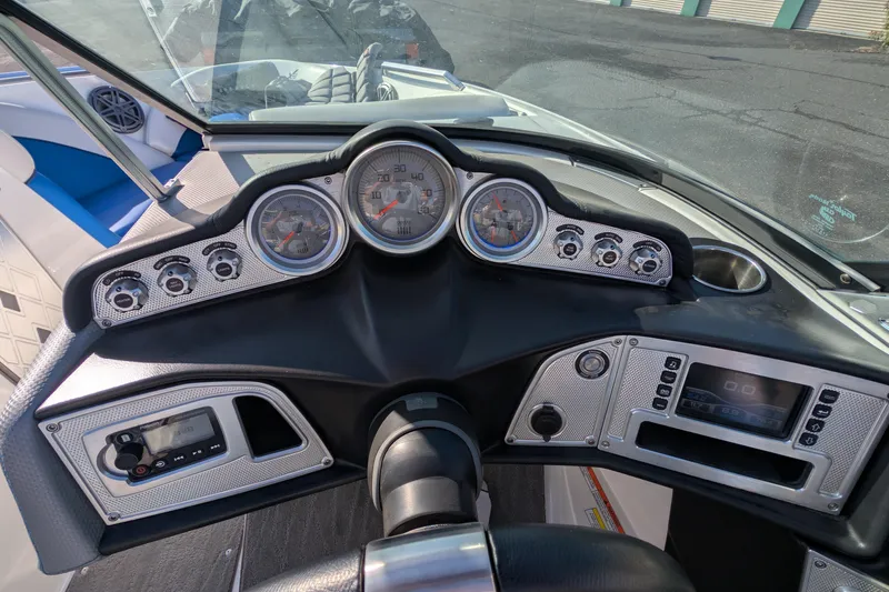 Slide: The Image of Dashboard of a 2016 MasterCraft X10 boat with gauges and controls. - 37