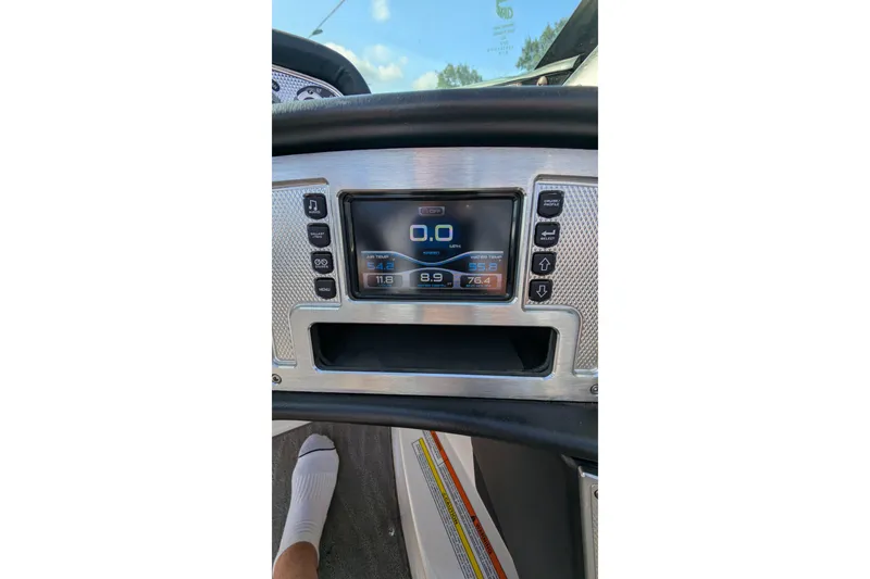 Slide: The Image of Dashboard of a 2016 MasterCraft X10 boat with digital display and controls. - 41