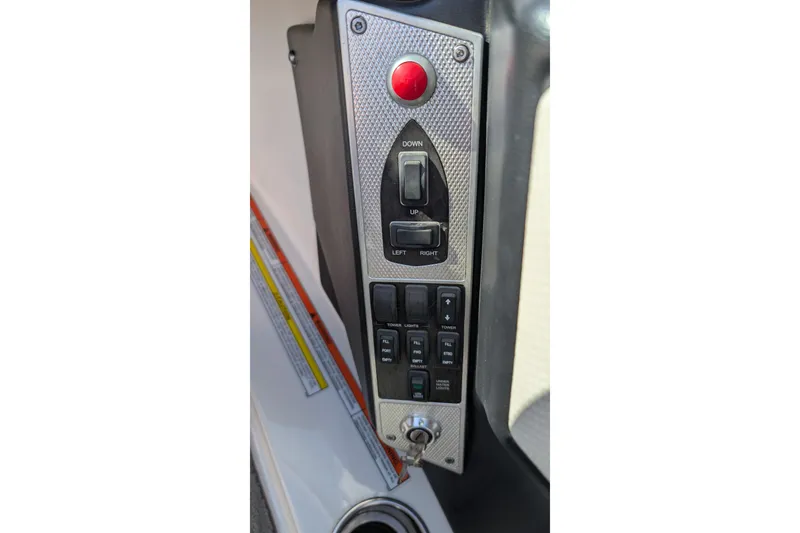 Slide: The Image of Control panel of a 2016 MasterCraft X10 boat with various switches and buttons. - 42