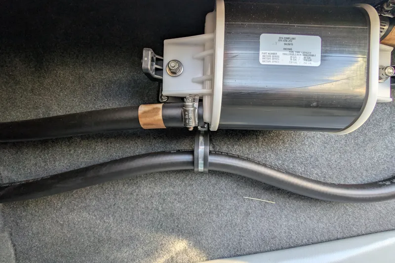 Slide: The Image of 2016 MasterCraft X10 boat component with hoses and fittings on carpeted surface. - 50