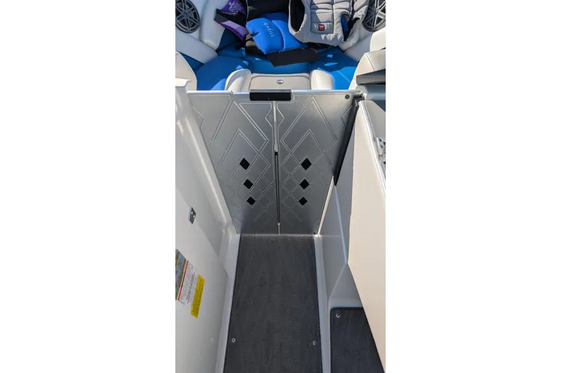 Slide: The Image of 2016 MasterCraft X10 boat interior with patterned flooring and seating. - 51