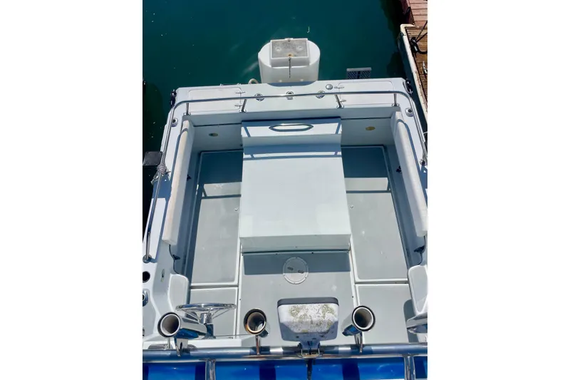 Slide: The Image of Bow view of 2000 Davis Rock Harbor 25 LC boat docked at a marina. - 14