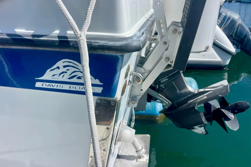 Slide: The Image of Side view of a 2000 Davis Rock Harbor 25 LC boat with diesel engine. - 4