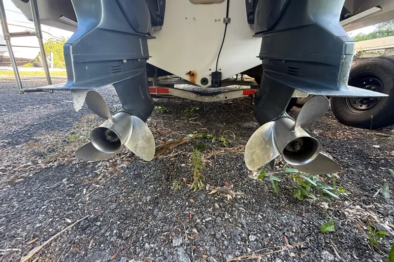 Slide: The Image of Twin propellers of a 2002 Century 2900 Walk-Around boat on a trailer. - 28