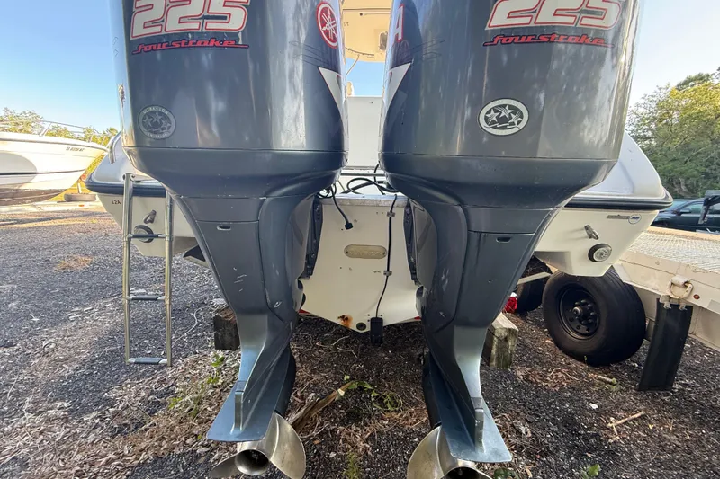 Slide: The Image of Rear view of a 2002 Century 2900 Walk-Around boat with twin Yamaha 225 engines. - 29