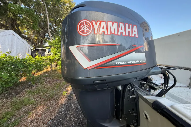 Slide: The Image of Yamaha four-stroke outboard motor on 2002 Century 2900 Walk-Around boat. - 32