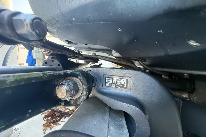 Slide: The Image of Close-up of a Yamaha F225TXRA engine part on a 2002 Century 2900 Walk-Around boat. - 34