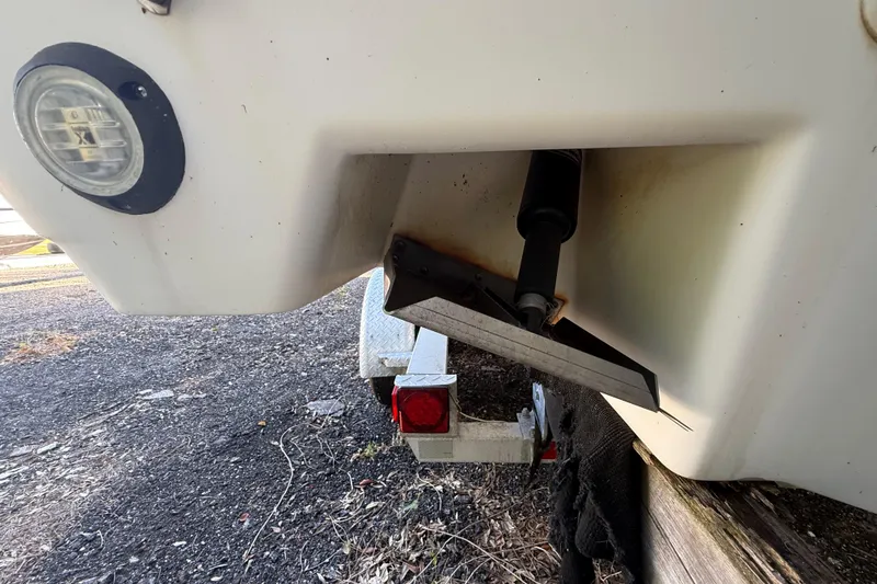 Slide: The Image of Rear view of a 2002 Century 2900 Walk-Around boat on a trailer. - 37
