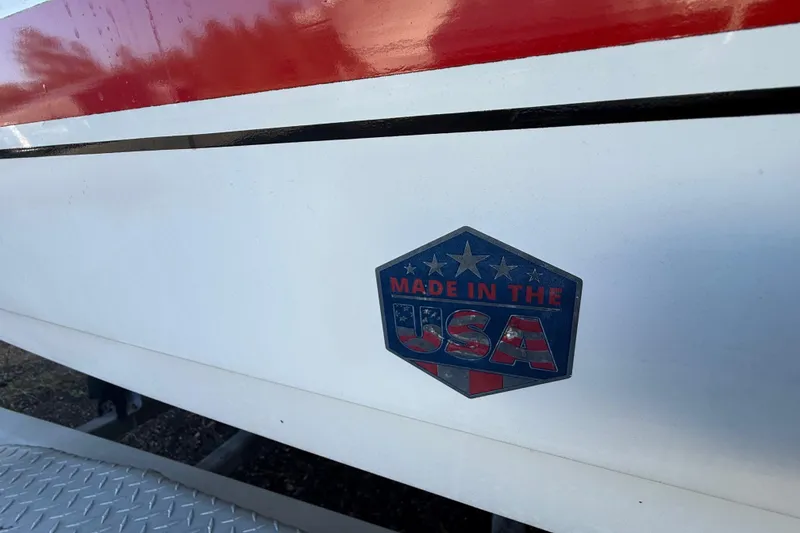 Slide: The Image of 2002 Century 2900 Walk-Around boat with "Made in the USA" emblem. - 38
