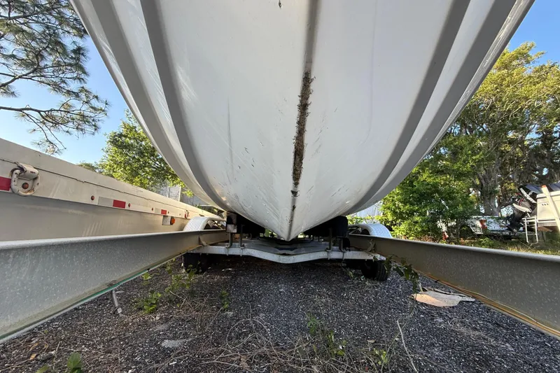 Slide: The Image of Underneath view of a 2002 Century 2900 Walk-Around boat on a trailer. - 42