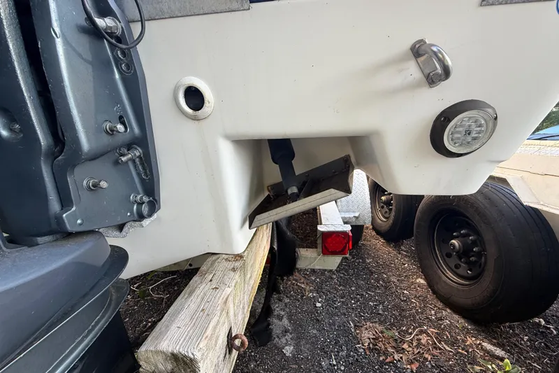 Slide: The Image of Rear view of a 2002 Century 2900 Walk-Around boat on a trailer. - 48
