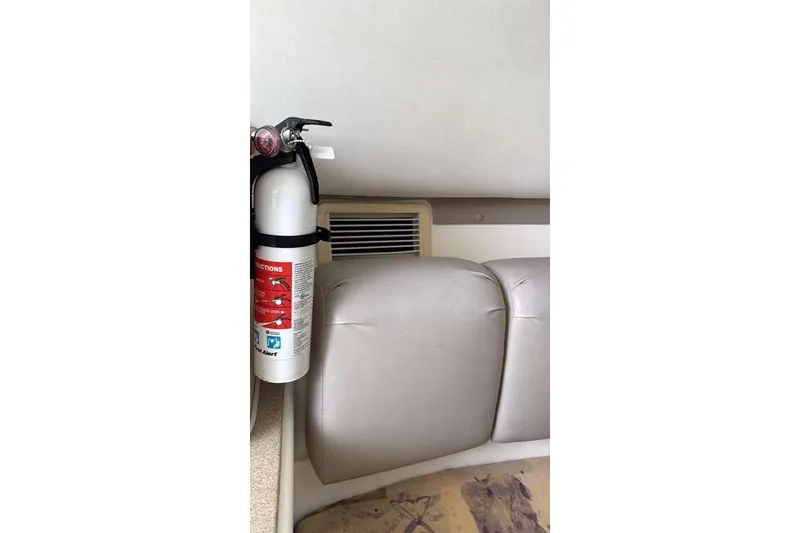Slide: The Image of Fire extinguisher mounted inside 2002 Century 2900 Walk-Around boat cabin. - 5