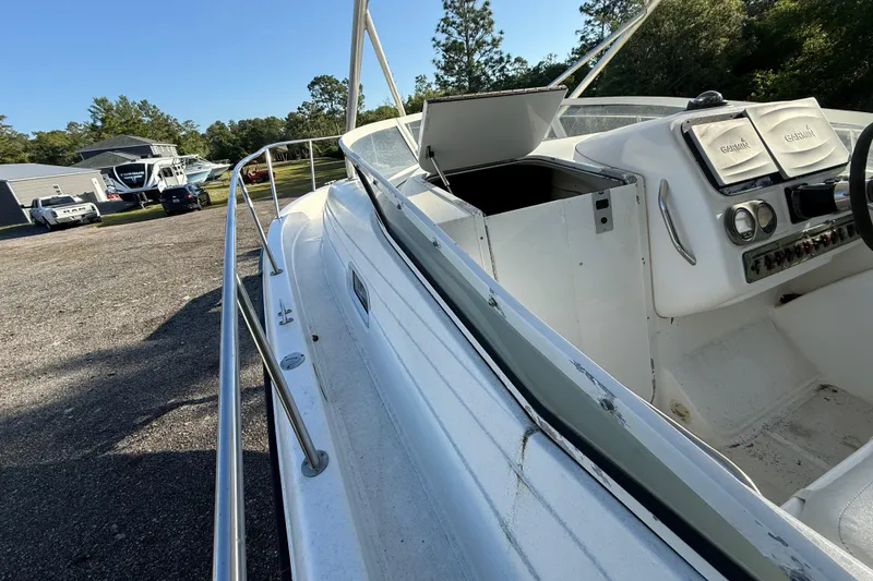 Slide: The Image of 2002 Century 2900 Walk-Around boat with open cabin and Garmin navigation system. - 51