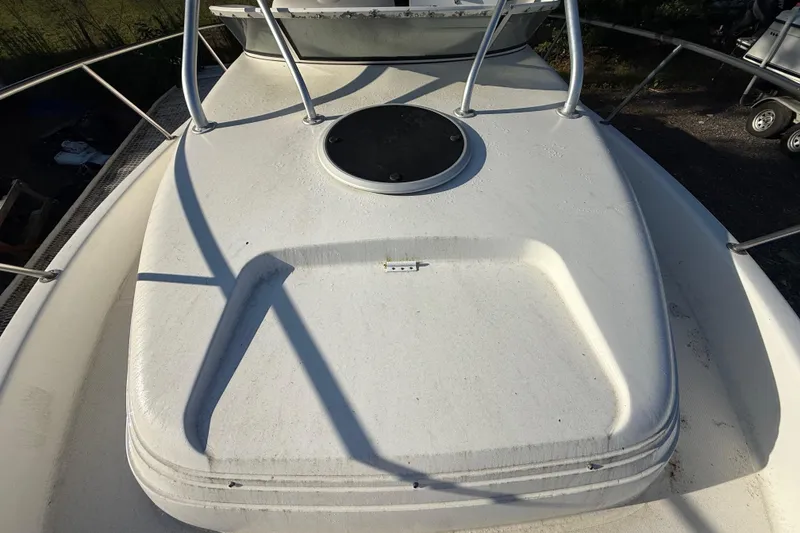 Slide: The Image of 2002 Century 2900 Walk-Around boat deck with hatch and railing. - 59