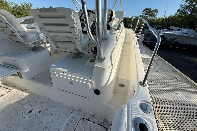 Slide: The Image of 2002 Century 2900 Walk-Around boat interior with seating and steering wheel. - 63