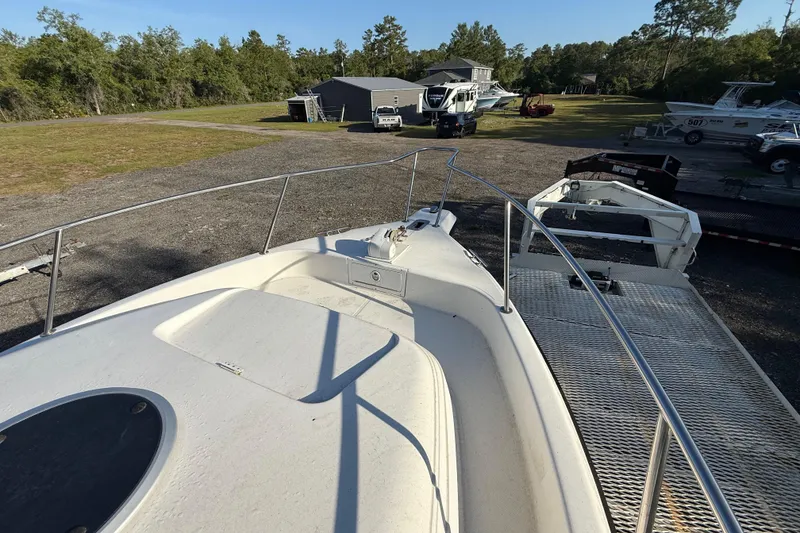 Slide: The Image of 2002 Century 2900 Walk-Around boat on trailer in outdoor storage area. - 69