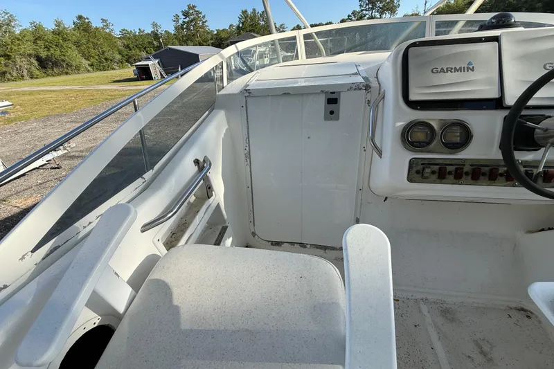 Slide: The Image of 2002 Century 2900 Walk-Around boat cockpit with Garmin navigation system. - 73