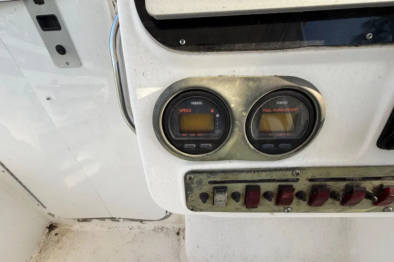 Slide: The Image of Control panel of a 2002 Century 2900 Walk-Around boat with Yamaha gauges. - 78