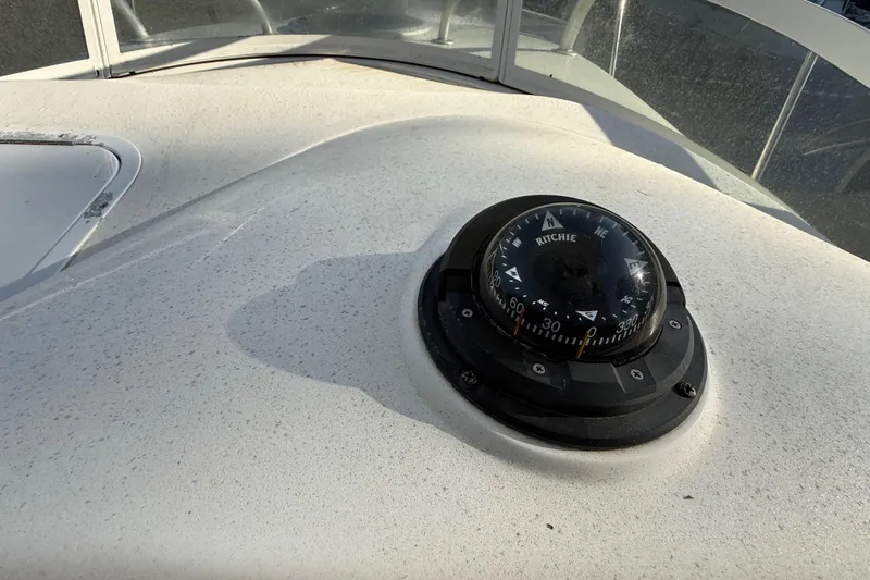 Slide: The Image of Compass on 2002 Century 2900 Walk-Around boat dashboard, showing navigation details. - 79